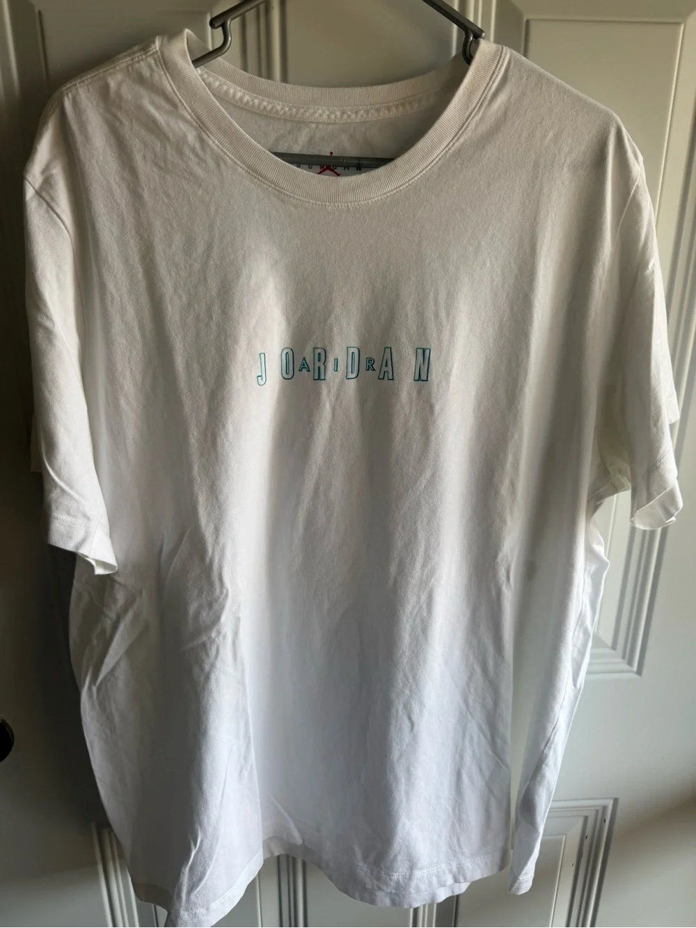 Jordan White Short Sleeve Tee with Teal Outline Lettering